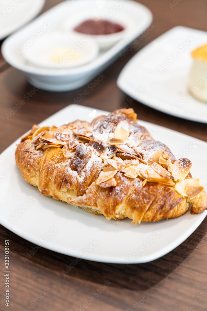 almonds croissants on plate almonds croissants on plate