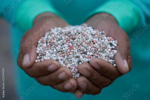 Bulk Blend Fertilizer in farmer hands.