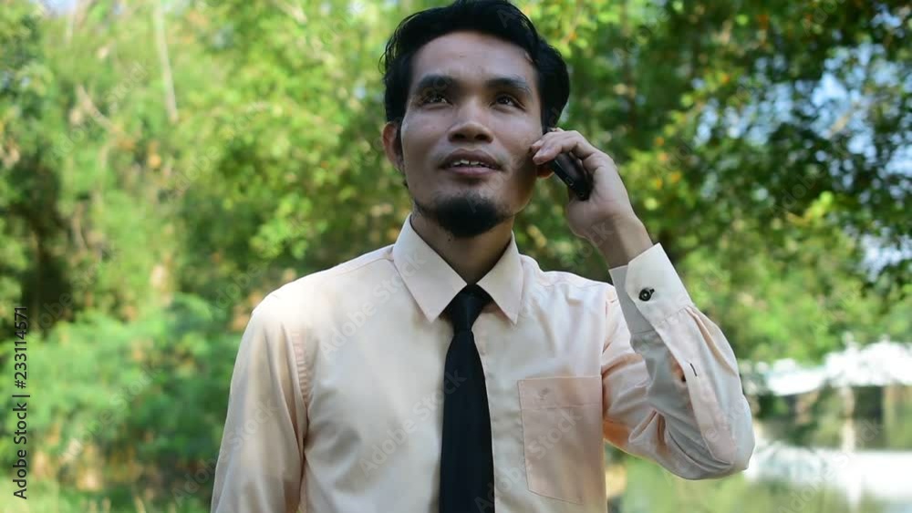 Businessman holding smart phone or mobile phone using call and happy smile success Businessman holding smart phone or mobile phone using call and happy smile success