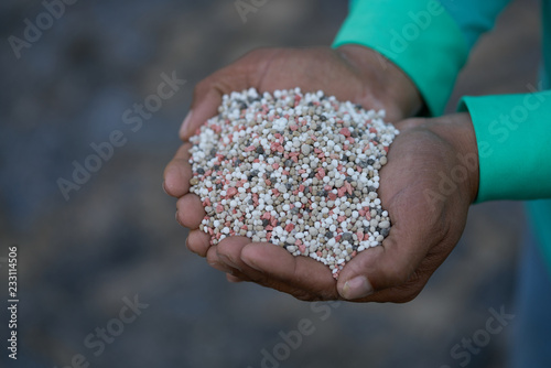 Bulk Blend Fertilizer in farmer hands.