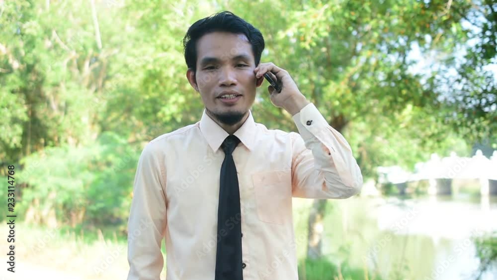 Businessman holding smart phone or mobile phone using call and happy smile success Businessman holding smart phone or mobile phone using call and happy smile success