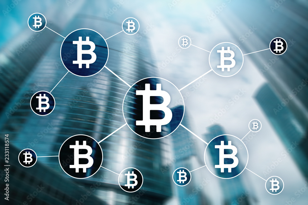 Bitcoin cryptocurrency and blockchain technology concept on blurred skyscrapers background. Bitcoin cryptocurrency and blockchain technology concept on blurred skyscrapers background.