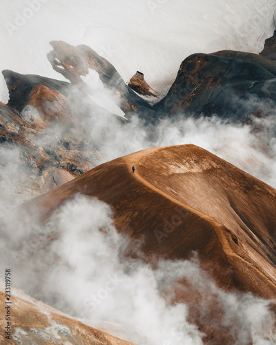 Hiker on volcanic Icelandic landscape