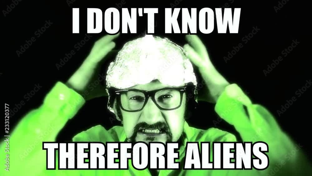 A pop culture reaction gif meme an angry man wearing a tin foil aluminium hat, and the