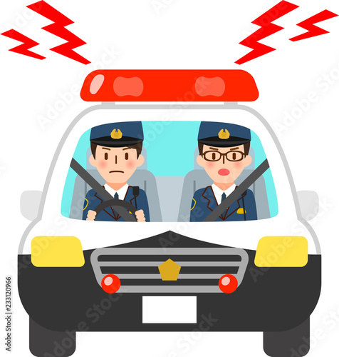 サイレンを鳴らすパトカーに乗った警察官