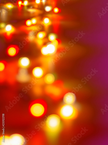 Decorative Colorful Blurred Lights On Purple .Background. Christmas Abstract Soft Lights. Colorful Bright Circles Of A Sparkling Garland