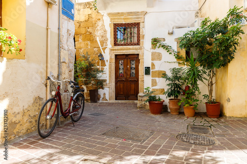 national flavor, ancient Greek streets on the island of Crete. Old houses, doors, Windows, potted plants and small outdoor cafes.