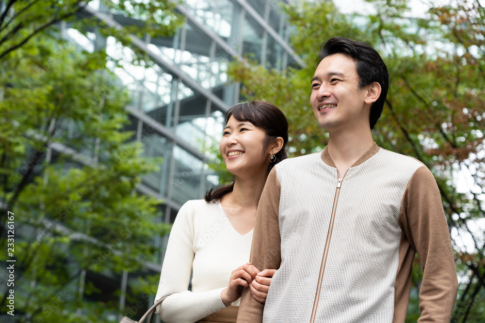 Naklejka premium young asian couple walking