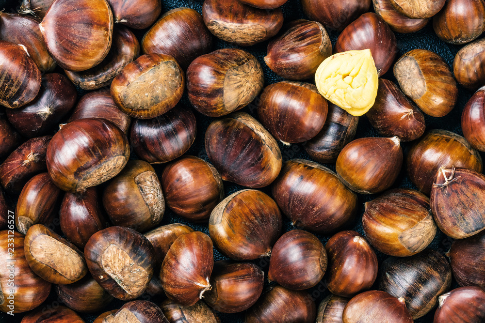 Roasted chestnuts served on an old table Roasted chestnuts served on an old table