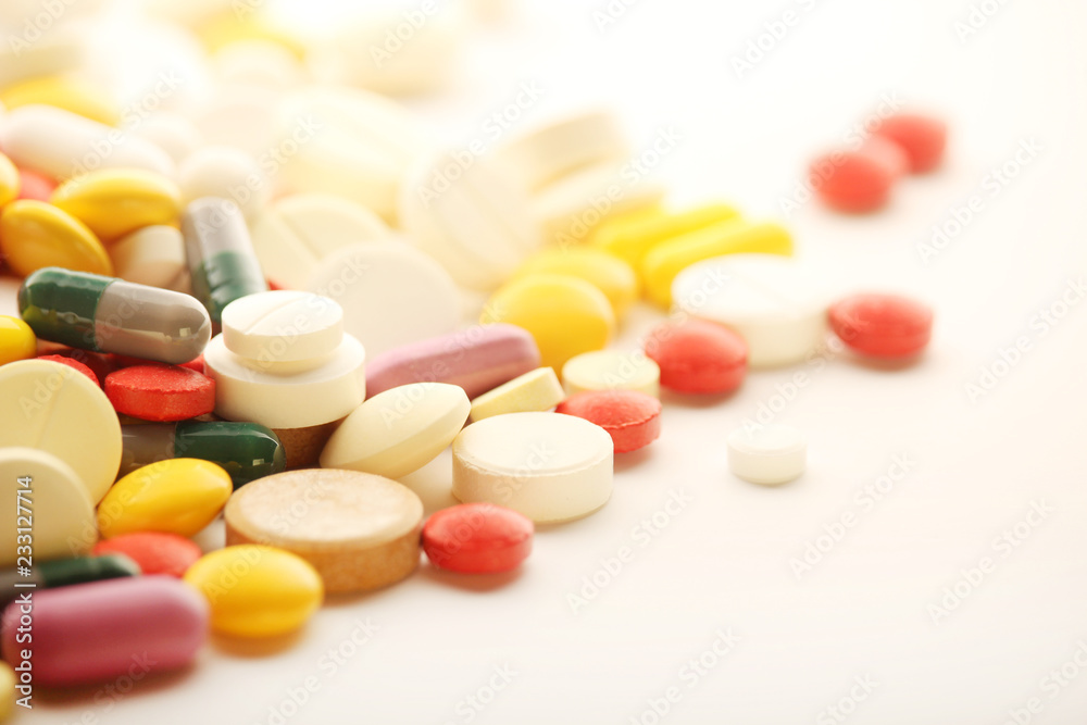 Different colorful tablets at white background Different colorful tablets at white background