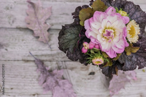 Autumnal bouquet with dahlias and ornamental leaves photo