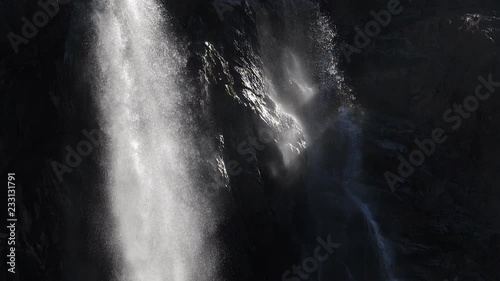 Beautiful slow motion detail of Gavarnie Falls at Cirque de Gavarnie, Pyrenees, France. Sunlit water. photo