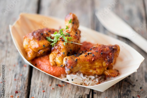 Jerk chicken served in a palm leaf dish (Jamaica) photo