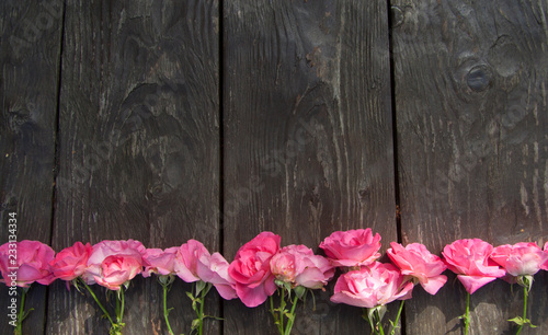 Fototapeta Naklejka Na Ścianę i Meble -  Pink rose bouquet on wooden rustic background