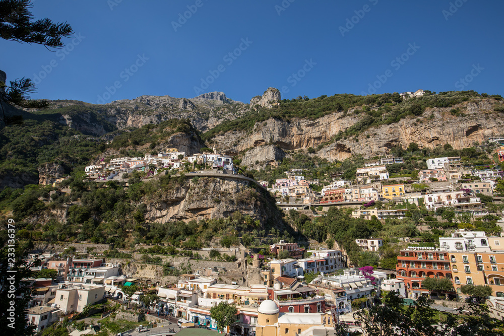 Colourful Positano, the jewel of the Amalfi Coast, with its multicoloured homes and buildings perched on a large hill overlooking the sea. Italy