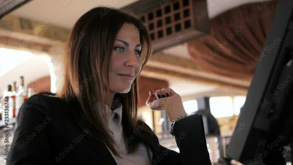 Waiter girl working with pos terminal or cashbox at cafe. People and service concept Waiter girl working with pos terminal or cashbox at cafe. People and service concept