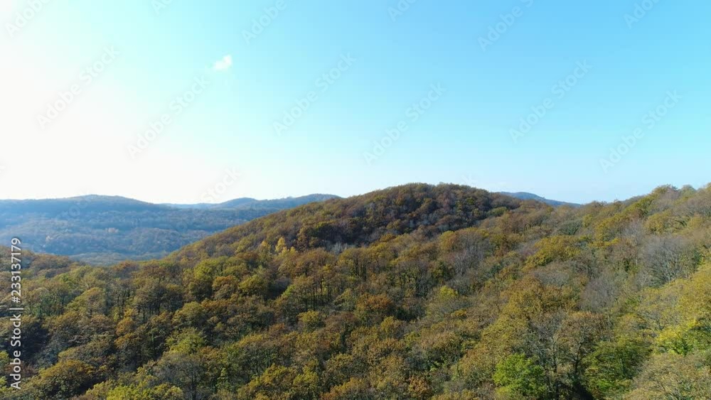 Aerial shots: the hills, the autumn forest and the trees and the blue sky. Aerial shots: the hills, the autumn forest and the trees and the blue sky.