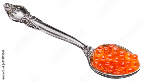 Spoon full of red caviar on white background. Macro picture. Clipping path.