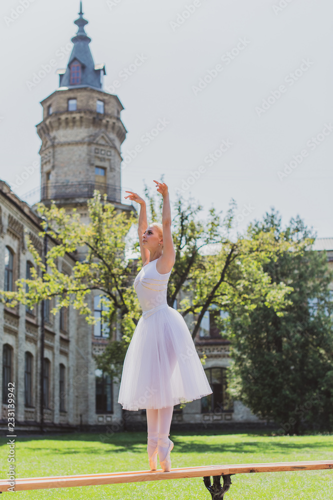 Ballet dancer at city streets, concept of elegant ballerina, inspired girl outdoor