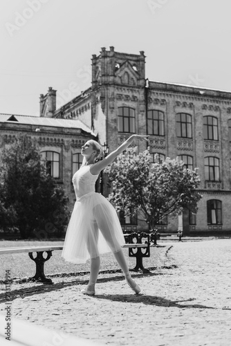 Ballet dancer at city streets, concept of elegant ballerina, inspired girl outdoor