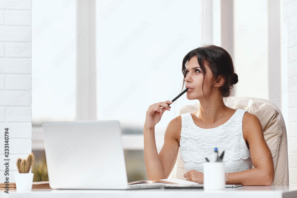 Young brunette business woman in a modern office Young brunette business woman in a modern office