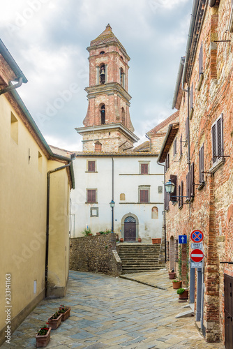 Fototapeta Naklejka Na Ścianę i Meble -  View at the Bell tower of church of Saint Michael Archangel in Lucignano - Tuscany,Italy