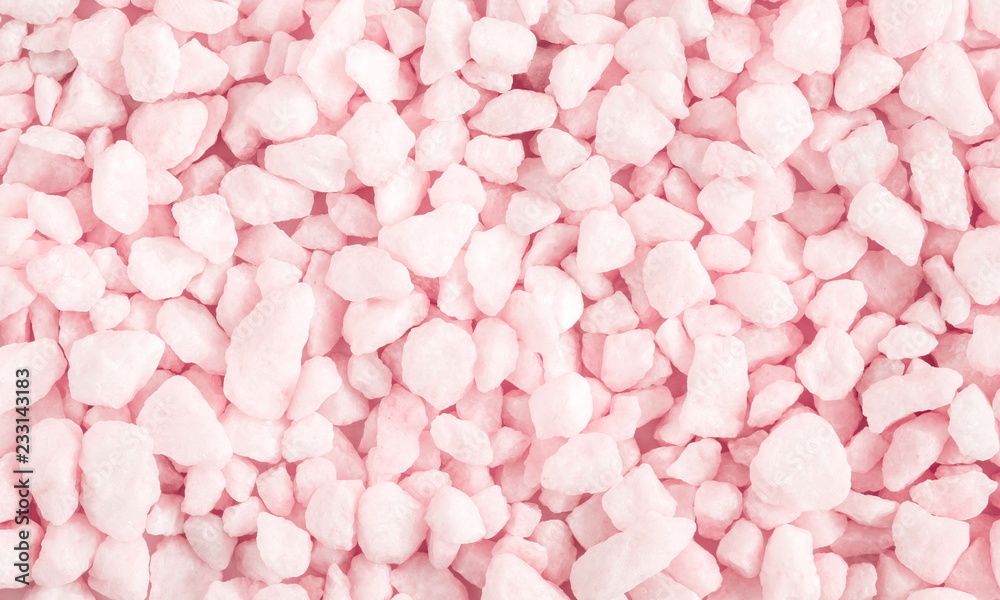 Pink light stone texture. Natural pink stones as a background. Flat lay, top view 