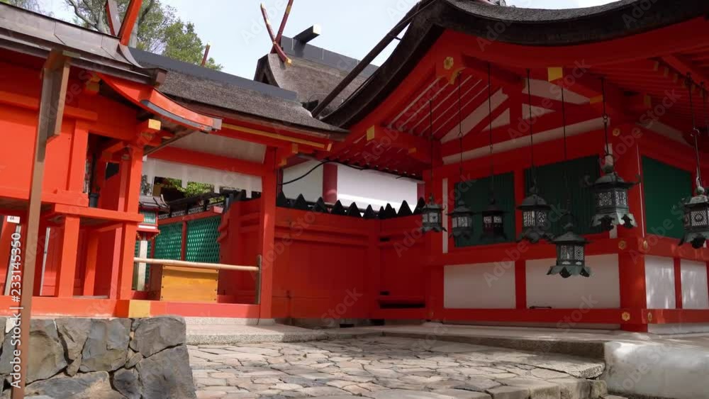 beautiful female traveler walking in the temple through the passageway full of lanterns beautiful female traveler walking in the temple through the passageway full of lanterns