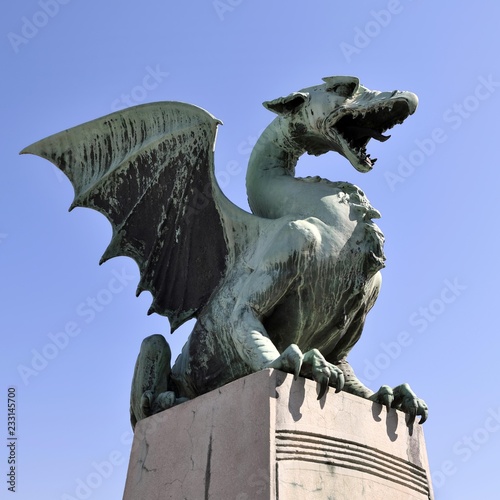 Bronze statue of a dragon on the Dragon Bridge, Zmajski Most, Ljubljana, Slovenia, Europe photo