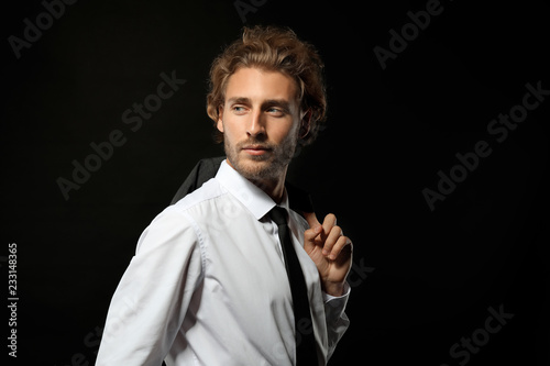 Handsome businessman on bla...