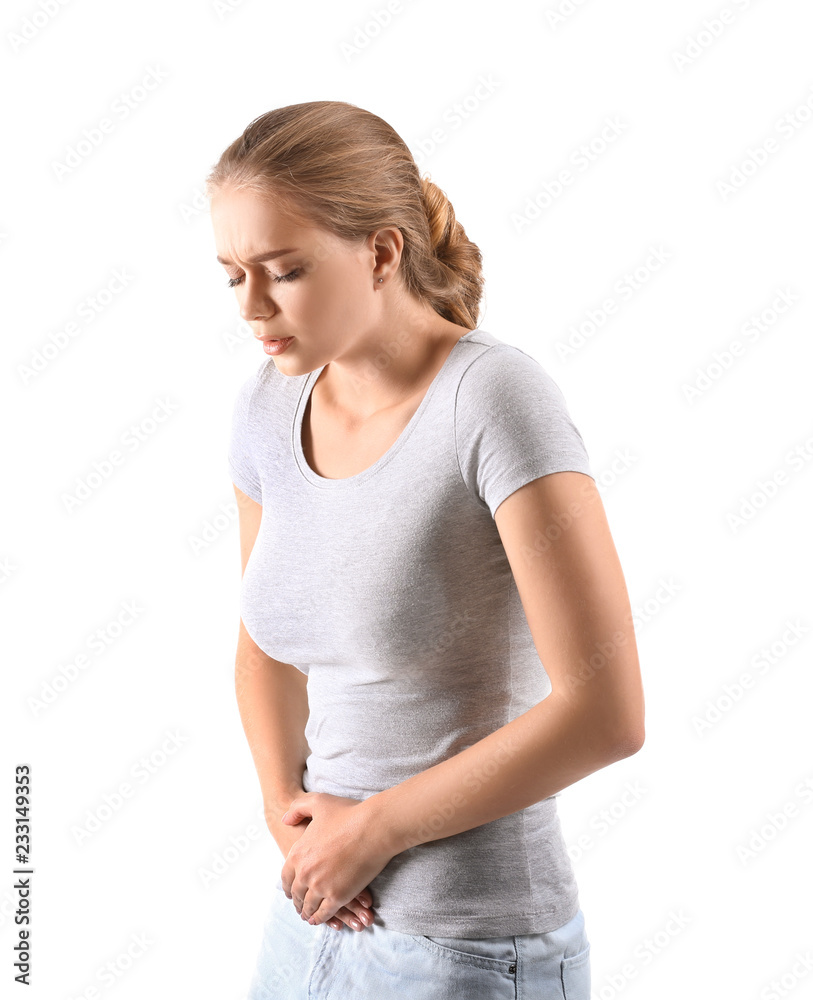 Young woman suffering from abdominal pain on white background Young woman suffering from abdominal pain on white background