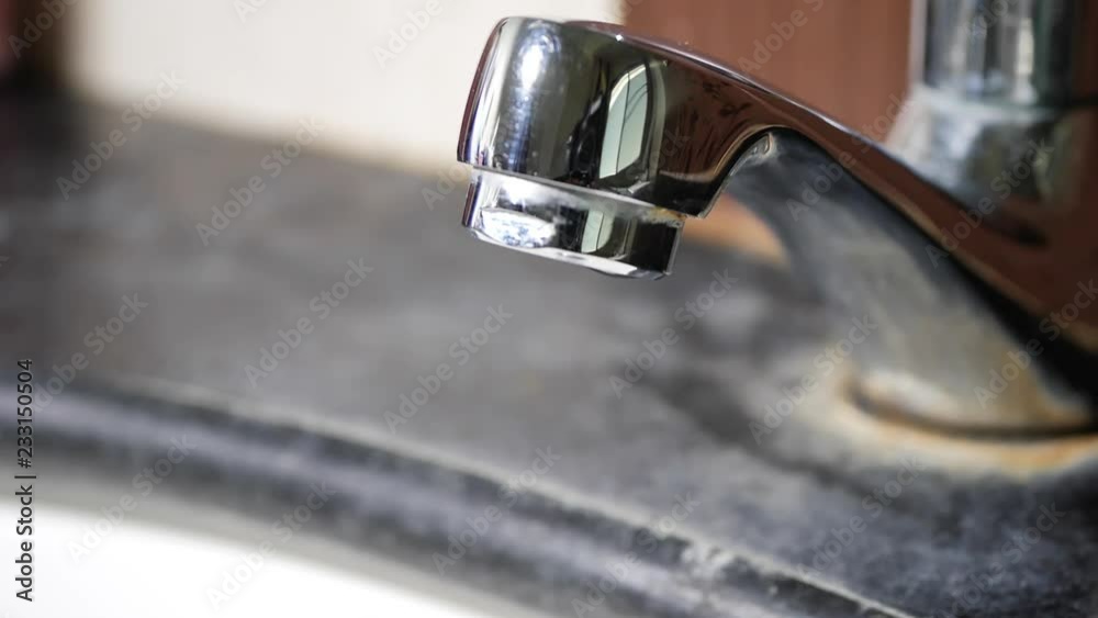 slow motion water drop leaking in close faucet slow motion water drop leaking in close faucet