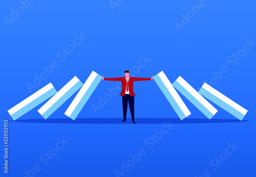 Businessman blocking domino effect
