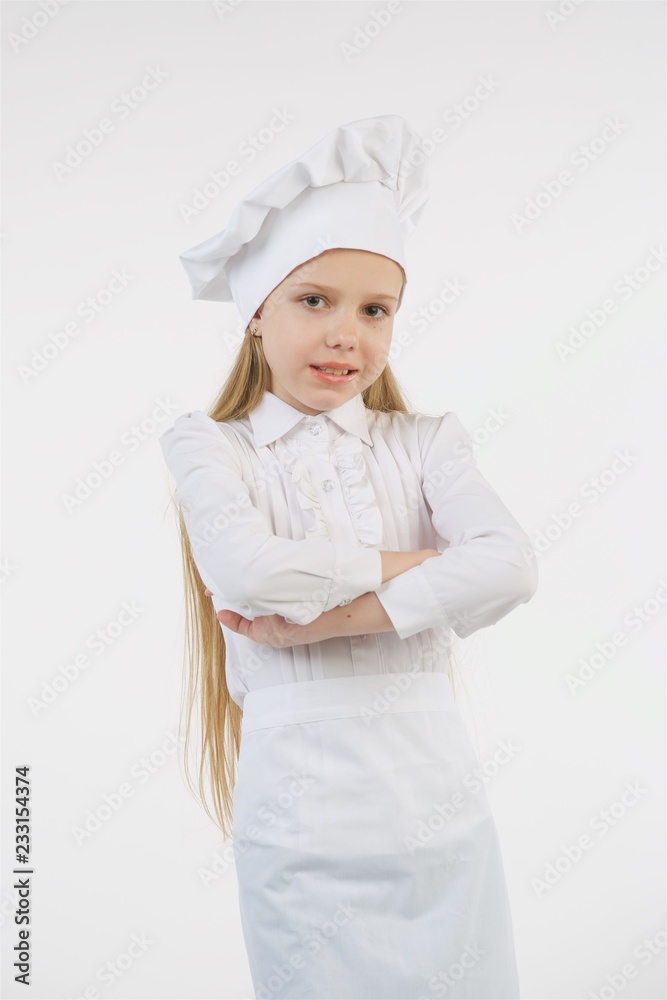 School-age girl dressed as a cook in white.