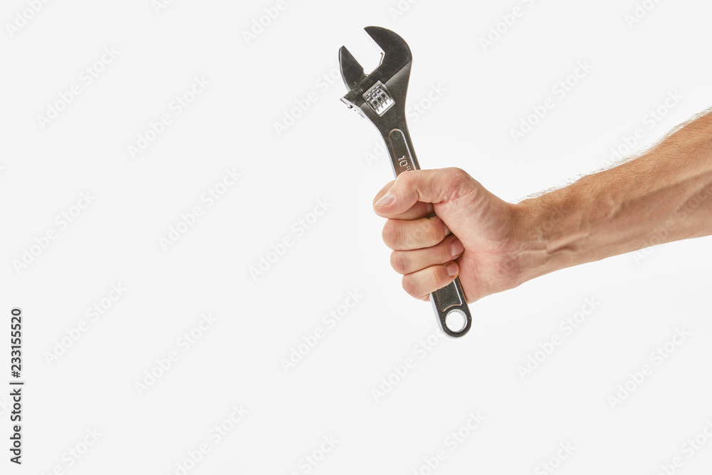 Partial view of man holding monkey wrench isolated on white Partial view of man holding monkey wrench isolated on white