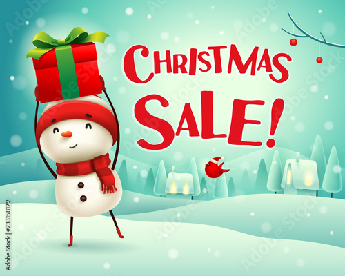 Christmas Sale! Cheerful snowman holds up gift present in Christmas snow scene winter landscape.