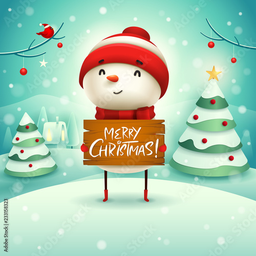 Merry Christmas! Cheerful snowman holds wooden board sign in Christmas snow scene winter landscape.
