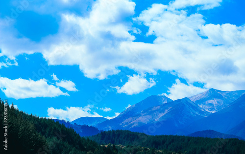 Fototapeta Naklejka Na Ścianę i Meble -  Beautiful view on the high snow mountains peaks, on the blue sky background. Mountain Alpine hiking paradise landscape, no people.