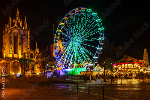 christmas market with carousel and cathedral in erfurt thuringia germany