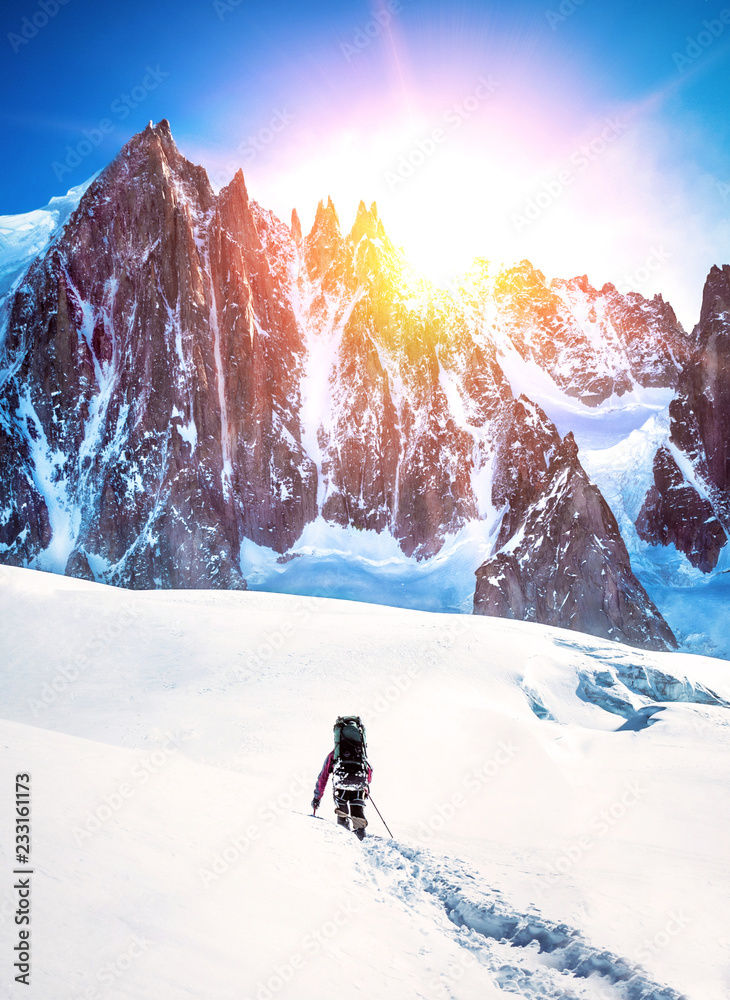 Group of climbers reaches the top of mountain peak. Climbing and ...