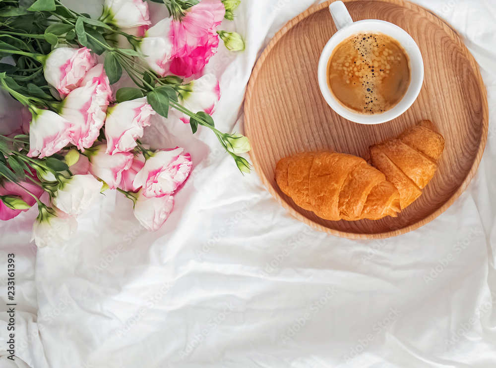 Breakfast in bed with coffee and croissants Breakfast in bed with coffee and croissants