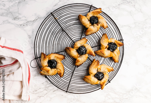 Scandinavian pastry Joulutorttu is traditional finnish and Swedish christmas pastry. It is traditionally made from puff pastry in the shape of a star or pinwheel and filled with prune jam and often du