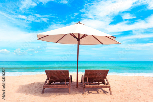 Fototapeta Naklejka Na Ścianę i Meble -  Chairs on the beach near sea. Beautiful tropical white beach. Holiday and vacation concept.