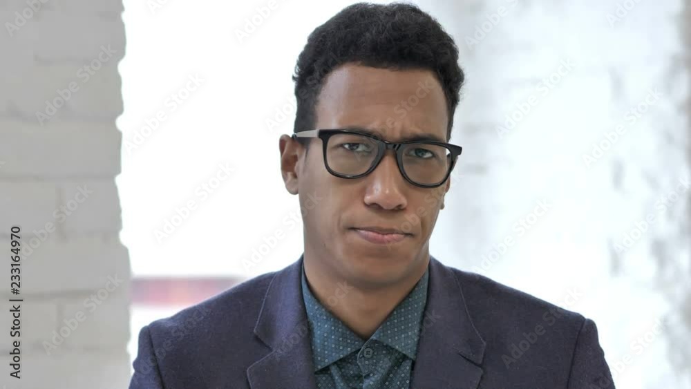 No, African Businessman Rejecting Offer by Shaking Head