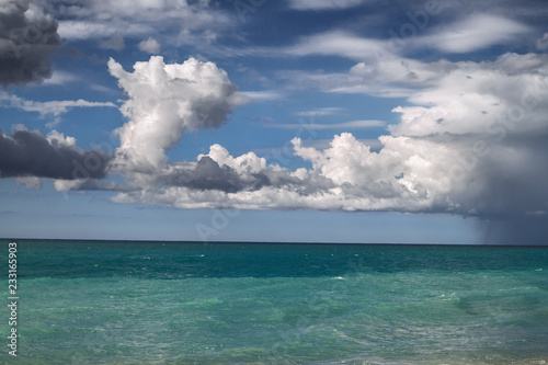 sea with blue sky and beautiful white clouds in the background