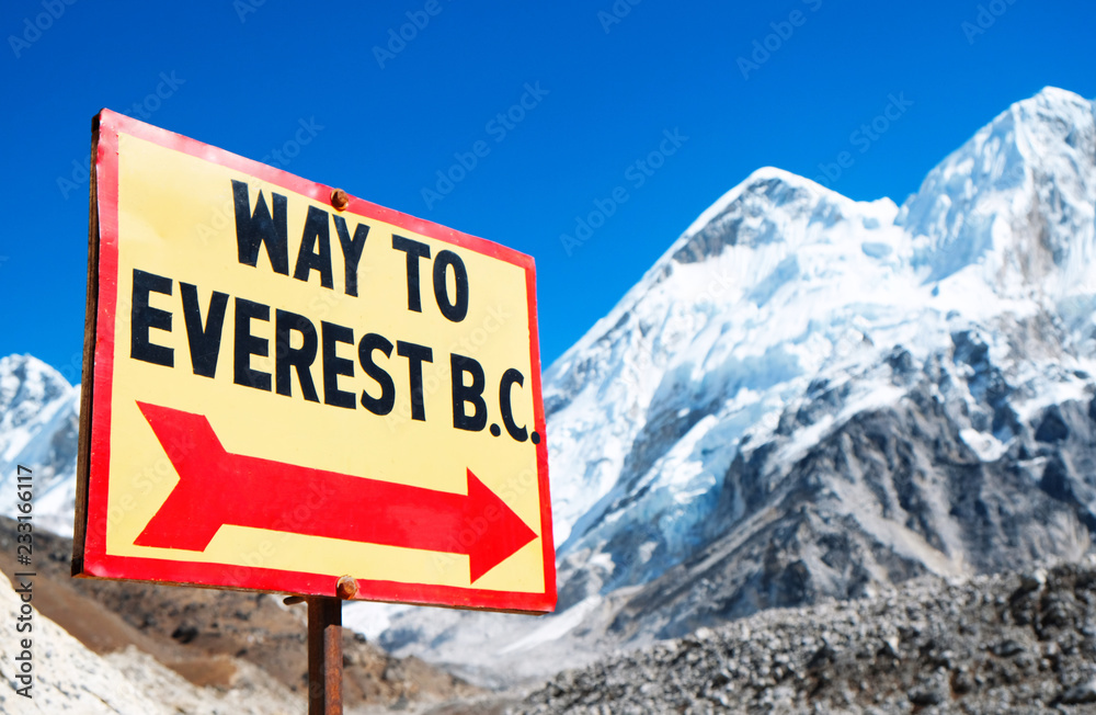 Signpost to the Mount Everest Base Camp. View of Everest and Nuptse from Kala Patthar.