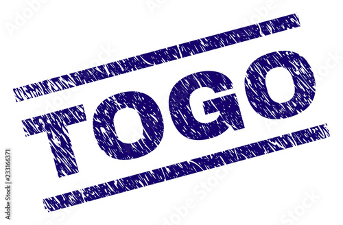 TOGO seal imprint with scratced style. Blue vector rubber print of TOGO text with dust texture. Text tag is placed between parallel lines.