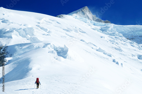 Mountaineer ascending summit 