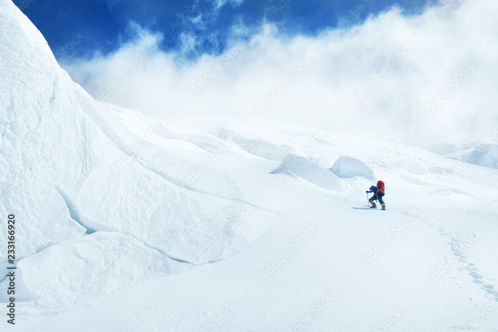 Climber reaches the summit of Everest. Mountain peak Everest. Highest mountain in the world. National Park, Nepal Climber reaches the summit of Everest. Mountain peak Everest. Highest mountain in the world. National Park, Nepal