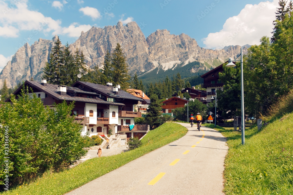 Beluno, Italy-August 9, 2018: The mountain village of Cortina di Ampezzo. tourists cyclists.